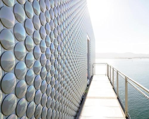 A ceramic skin composed of 270,000 circular pieces reflects the changing light of the sky and sea / Botin Center
