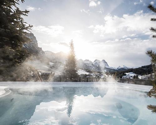 An outdoor pool surrounded by the Dolomites is one feature of the Tofana / noa*