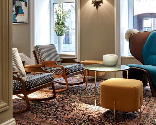The hotel’s guest rooms and side terraces look out at the café-lined waterways of the Nikolaifleet canal and the Altstadt Old Town beyond / Design Hotels