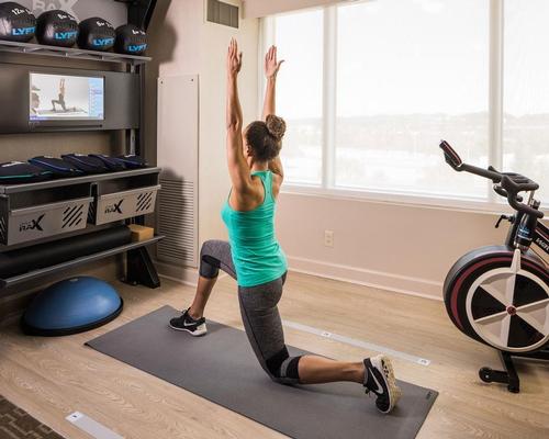 A fitness space – around 100sq ft (9 sq m) – is located near a room’s window and features sports-performance flooring / Hilton