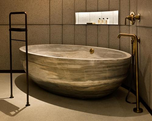 The suite's master bathroom has been built around a freestanding one piece marble Palissadro bathtub
