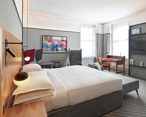 Each guest room has been designed in a residential style, with the existing timber panelling preserved but stained in a contemporary fashion / Andaz London Liverpool Street