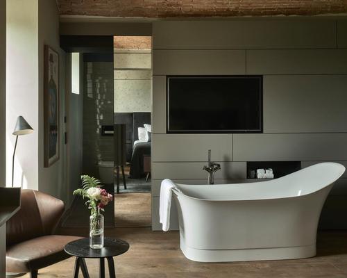 Tiled bathrooms, black leather headboards and distressed brown leather sofas feature in many rooms and suites / Design Hotels