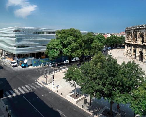 The museum has a transparent ground floor – from which visitors can view the Arena – topped by a shimmering glass façade / Serge Urvoy