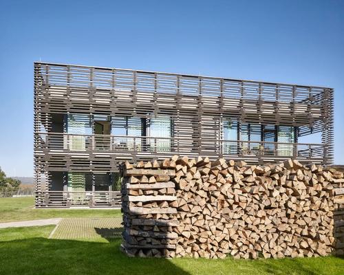 Local timber was used for the building's distinctive charred facade / Michael Moser