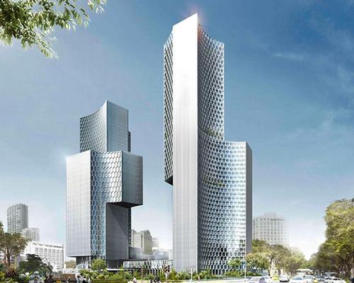 German architect Ole Scheeren designed the concave skyscrapers, which are 186 and 170m high and clad in a latticework of hexagonal windows / Buro Ole Scheeren