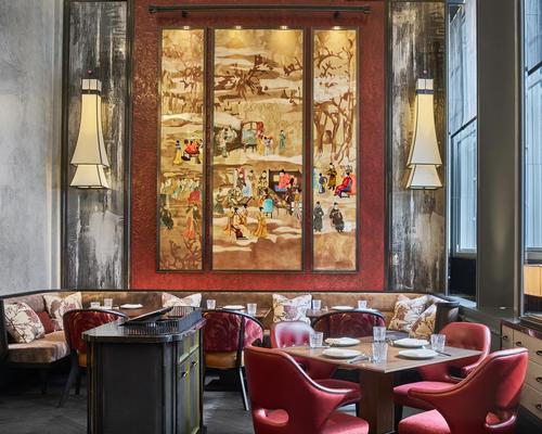 The restaurant's central focal point is a red lacquer frame holding an ornate three-layer gilded triptych / AB Concept
