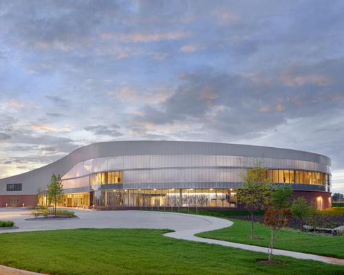 The ground plane was lifted and the building was nestled into the raised landscape, offering shelter while maintaining green spaces / CannonDesign