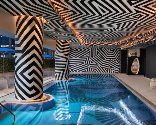 The WET Deck's pool is designed with a mosaic of tiles reminiscent of the shadows cast by palm fronds