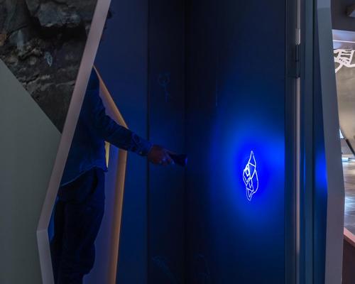 Visitors can generate luminescent rock carvings in the dark by torchlight / Kvorning Design & Communication