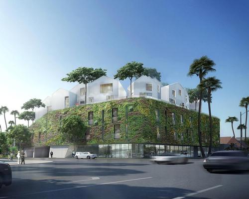 The project has been wrapped in one of the largest outdoor living walls in the U.S.