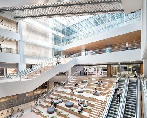 Formerly a shopping centre, the reincarnation is now primarily a business proposition, with office spaces being its main function. However, the space has kept up some of the leisure offering. / Yuzhu Zheng