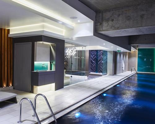 On the wellness side, the club contains a range of thermal experiences and a dramatic black swimming pool / Third Space