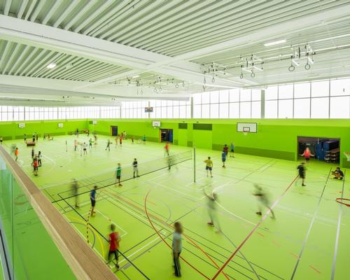 The main sports hall has been painted a vibrant green to appeal to the children who use the facility / Sue Baer Fotografie