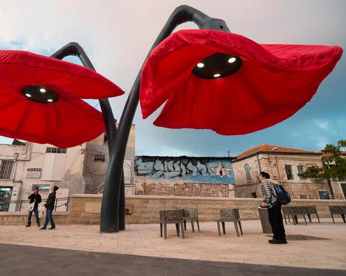 HQ Architects created a pair of giant flowers in Jerusalem which bloom when they sense people approaching / HQ Architects