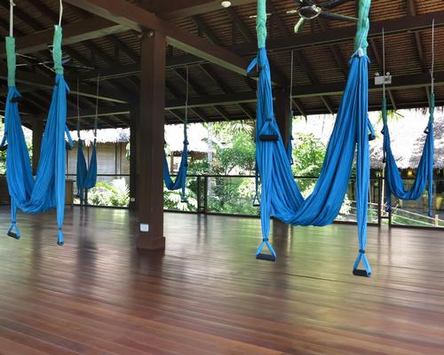 The open-air wellness pavilion is equipped with flying yoga hammocks that are used in conjunction with the resort’s yoga classes, and boasts 360-degree views