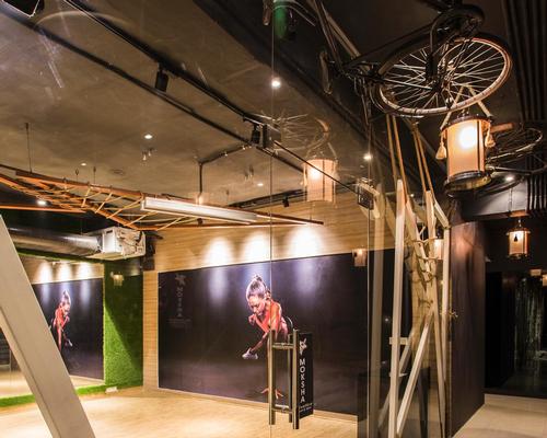 Bicycles are suspended from the ceiling to promote the idea of activity / Studio Ardete
