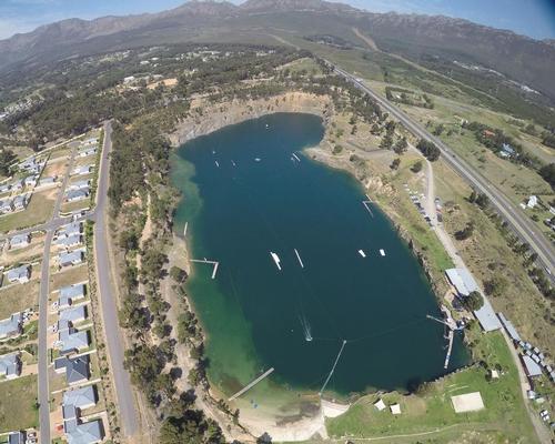 The site is located by a former quarry, which has been filled with water and transformed into a popular lake / Blue Rock