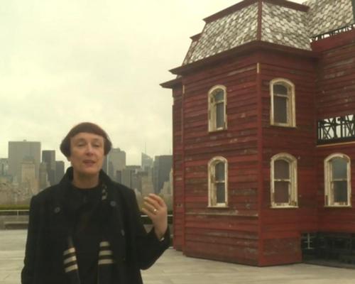 Parker used blood-red paint, wooden floors, whitewashed posts and corrugated steel roofing to underline that the materials were once used for a barn on a New York farm / The Metropolitan Museum of Art