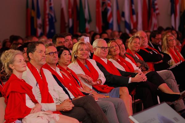 Delegates received red scarves