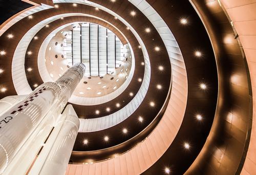 The grand lobby, which is lit by multiple portholes – has been likened to a solar chimney. / Photo by Kris Provoost