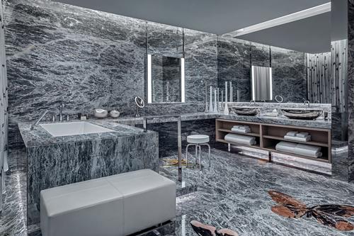 Amenities include a salt relaxation room, a jacuzzi, massage tables, a bar, a fitness studio, and two media lounges. / Courtesy of the Palms Casino Resort