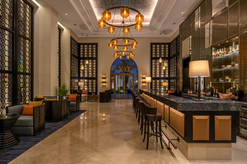 On-site amenities include five culinary experiences, an 18-hole golf course, and an expansive spa and wellness centre. / Courtesy of Hilton Hotels