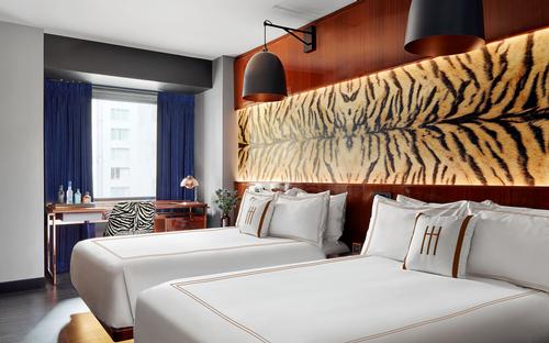 Guestrooms feature a number of faux animal skin furnishings. / Courtesy of Marcello Pozzi