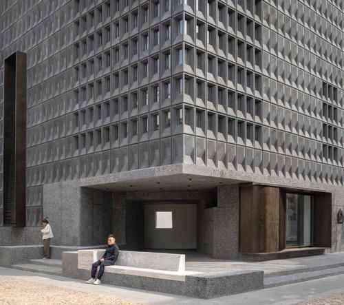 The neo-Brutalist structure is composed of 