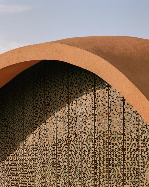 Screen filters on the building are inspired by mashrabiya windows / Oppenheim Architecture