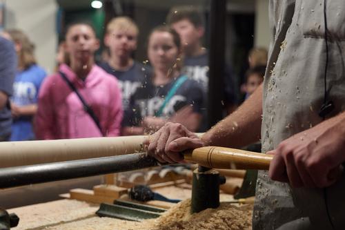 An audience for the demonstration of traditional hand-turning skills