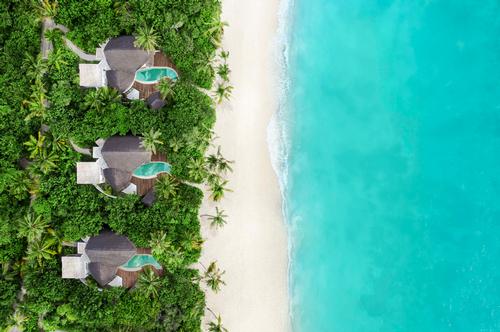 There will be 29 secluded one- and two-bedroom beach villas nestled among the island’s lush greenery, each with its own private beach area