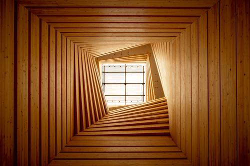 A three-storey skylit atrium marks the point where four of the buildings meet / NAARO