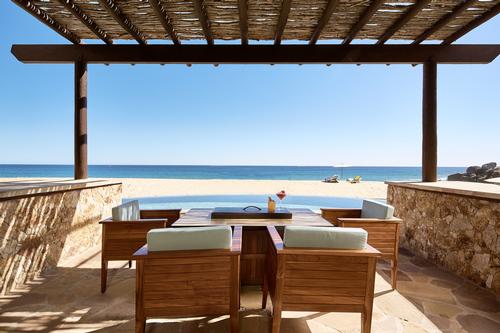 A beachfront suite terrace / Hilton
