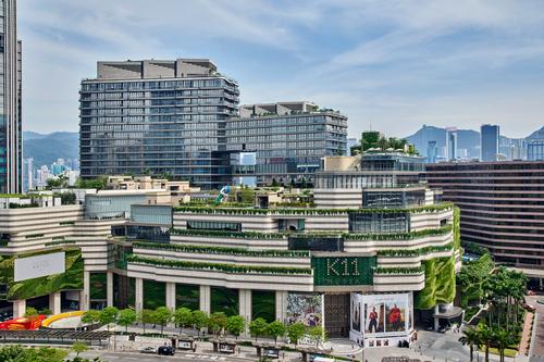 Greenery is used to cover parts of the building / Francis Chen, Vacuum Workshop