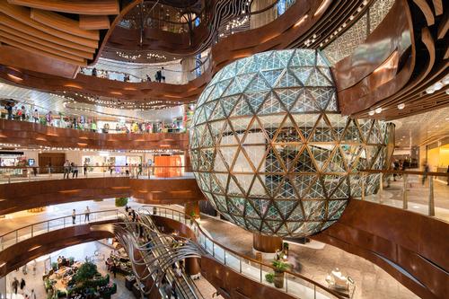 An eight-storey atrium features lighting by Speirs+Major and an interactive space designed by LAAB Architects / K11 Musea