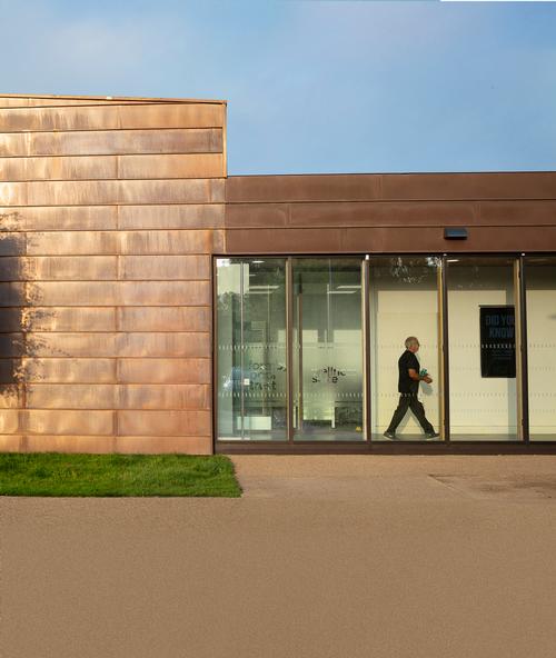 Timber were among the materials used to match the existing building / Tamara Shiner