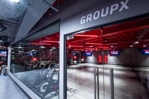 Group exercise areas accommodate large classes / UFC Gym