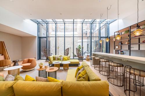 The interiors combine cork, wood and glass in a nod to the hotel's location in the Champagne region of France / Naiim de la Lisière