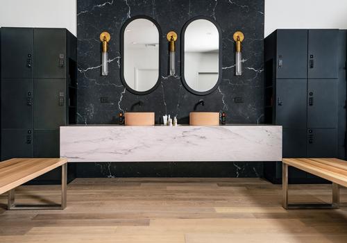 There us a refresh area with a custom marble vanity and backsplash unit / P.volve