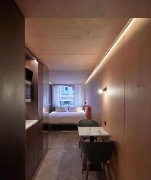 Each room contains a sleeping-cum-lounging area, a bathroom and a kitchen / Edmund Sumner