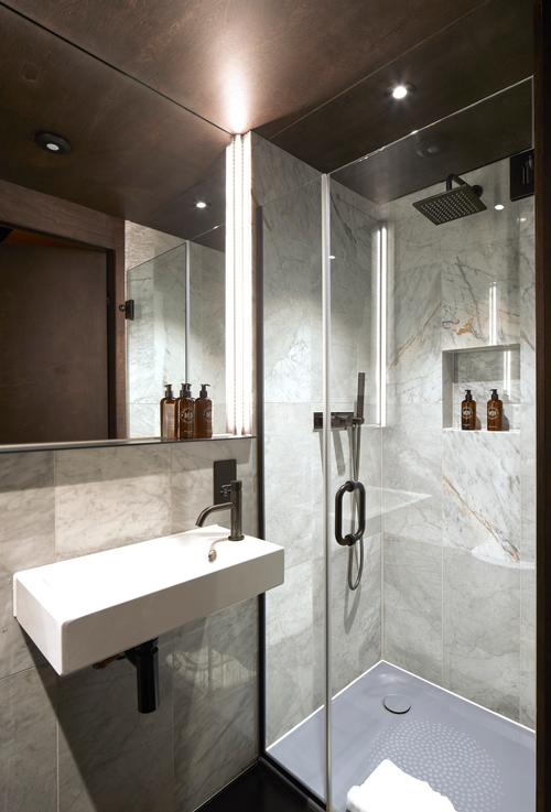 The guest room bathrooms each have a walk-in shower / Edmund Sumner