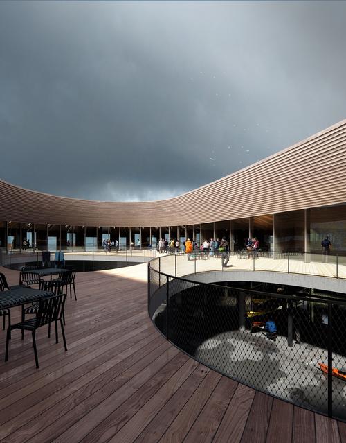 An open-air space on its upper level is sheltered by the building's circular exterior / WERK/Snøhetta, visuals MIR