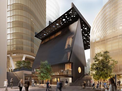 The community building has a steeply pitched roof that references the design of early settlers' houses / Adjaye Associates