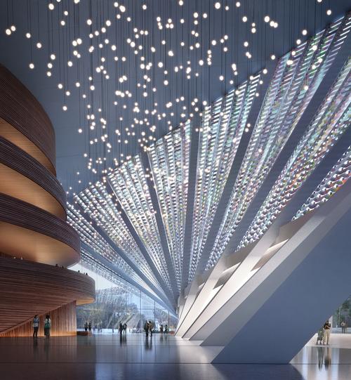 The building's façade filters light that enters the lobby / Plomp