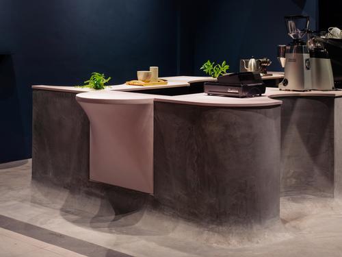 The base of the counter is cast in concrete and is designed to merge into the floor / Khoo Guo Jie
