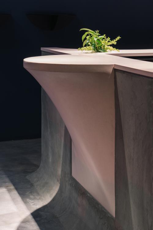 A powder pink concrete countertop was cast in 11 different sections / Khoo Guo Jie