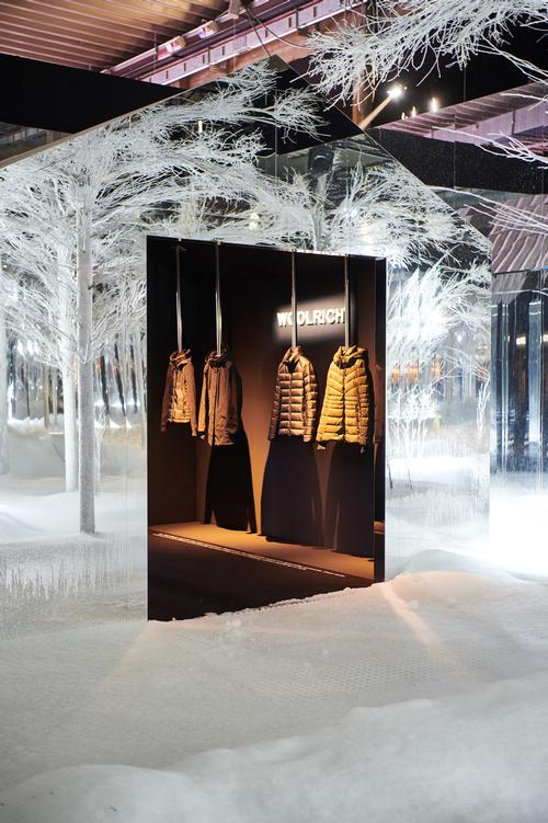 Pods showcasing Woolrich clothing products were installed around the edge of the space