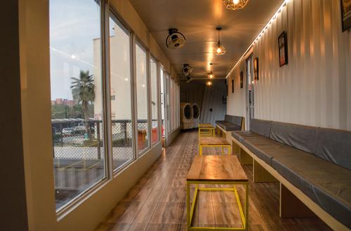 Rooftop and window seating provide views out onto adjacent green space / Rahul Jain