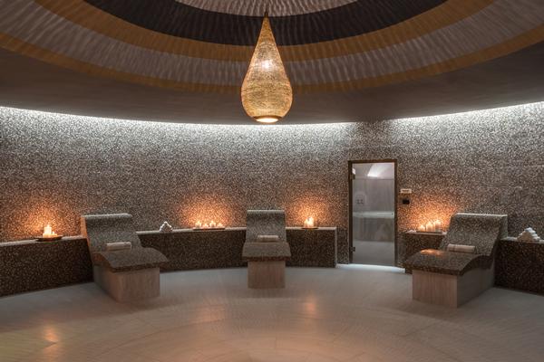 The interiors of the Euphoria Retreat include many vaulted ceilings and arches, reflecting the design of local churches